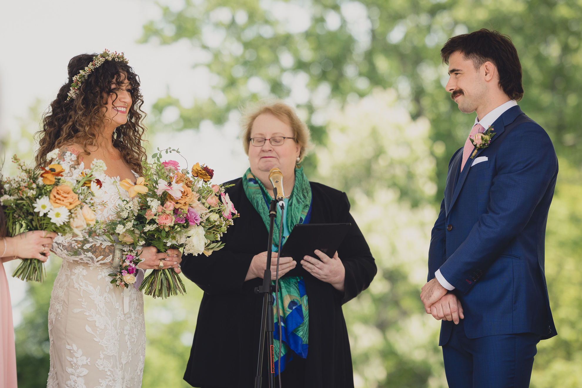 bride and groom smile at the terrace at marcy casino rose garden wedding ceremony