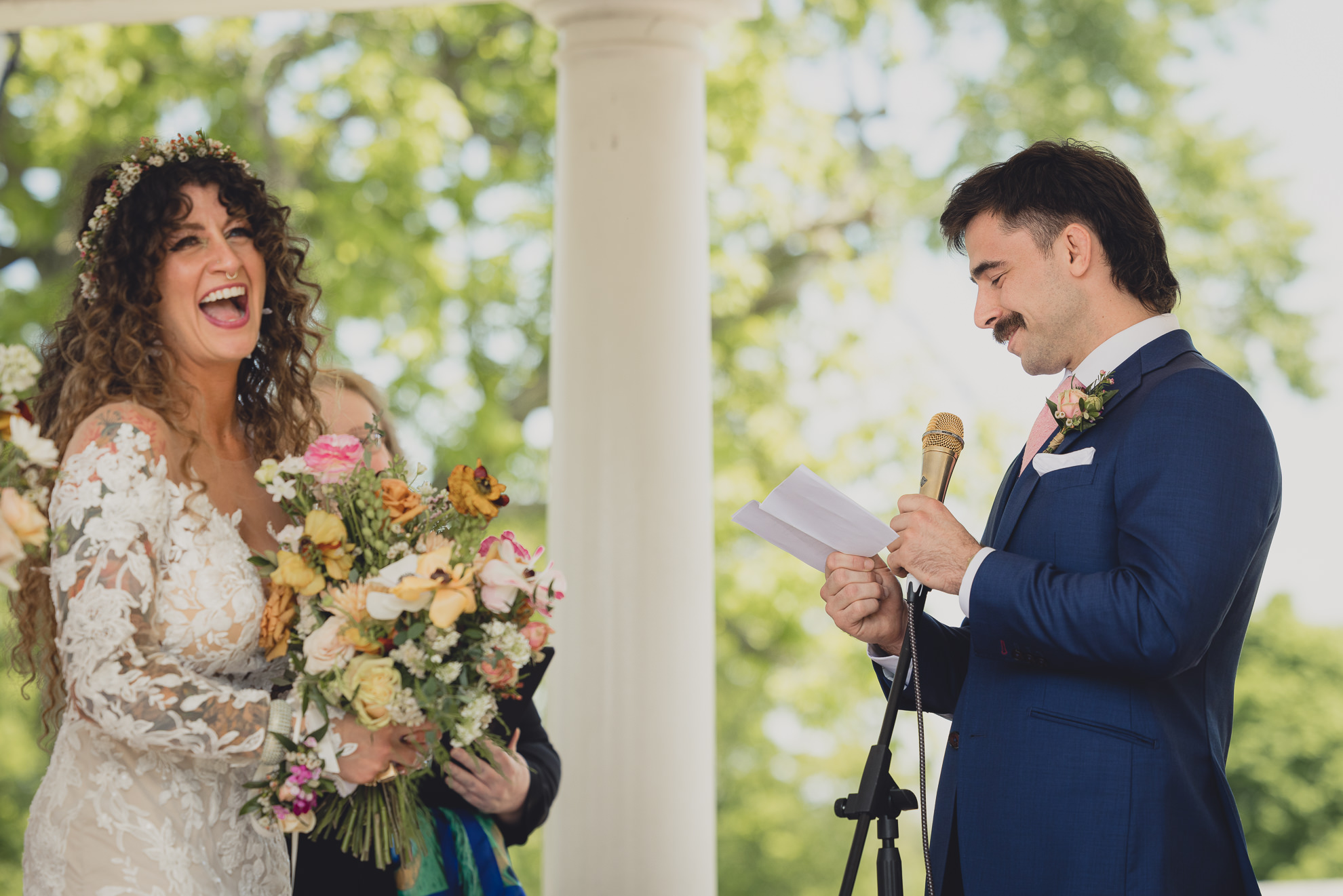 couple says vows while laughing at the terrace at marcy casino rose garden wedding ceremony