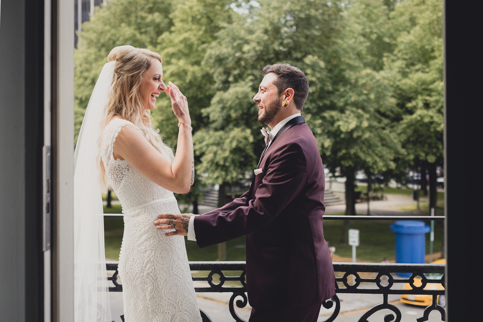 bride and groom share a reveal of first look before wedding at Hotel Lafayette in Buffalo, NY