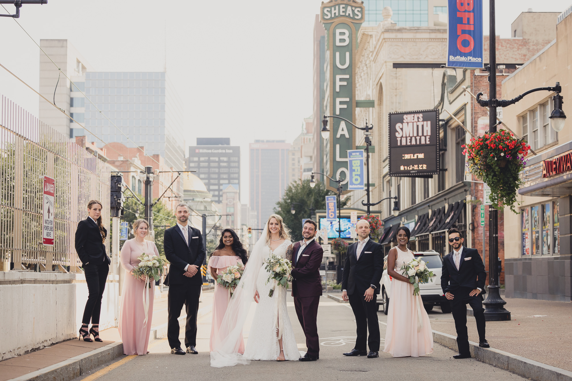wedding party pose for portraits near Shea's theater in Buffalo, NY