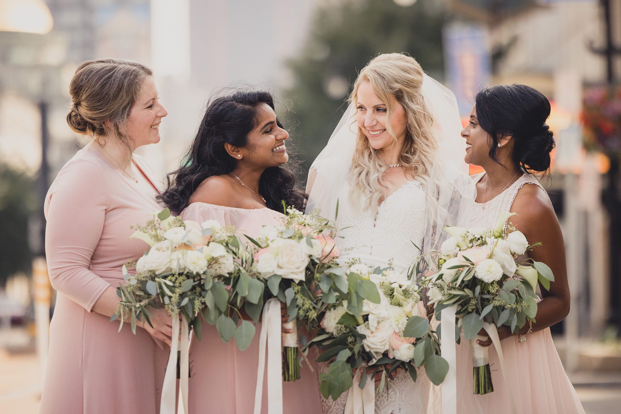 wedding party poses for portraits near Shea's theater in Buffalo, NY
