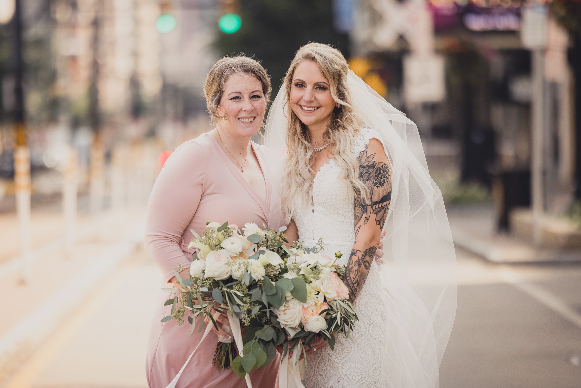 wedding party poses for portraits near Shea's theater in Buffalo, NY