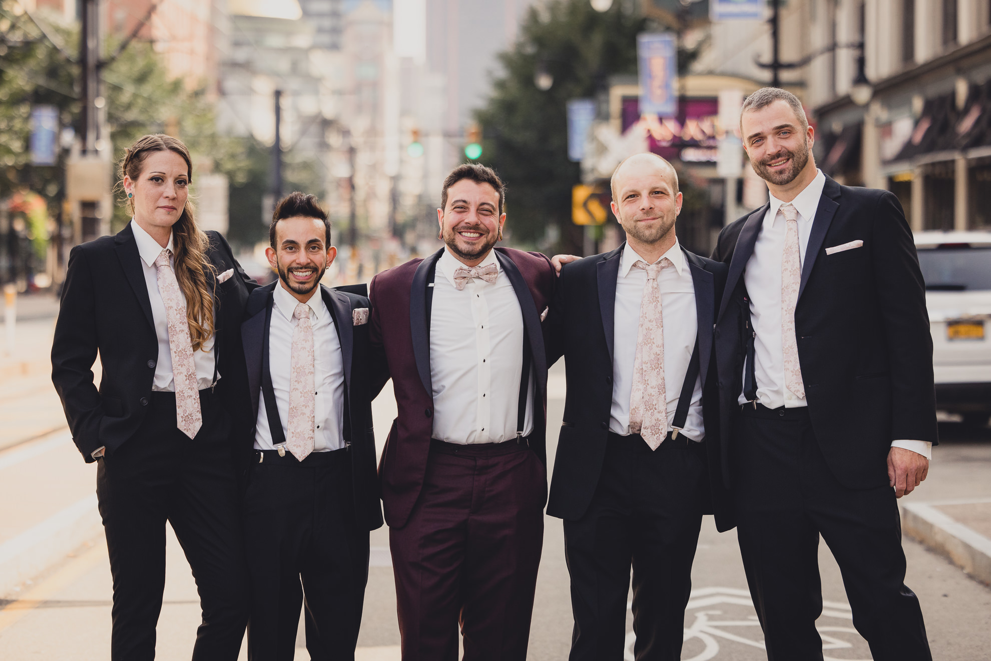 wedding party poses for portraits near Shea's theater in Buffalo, NY