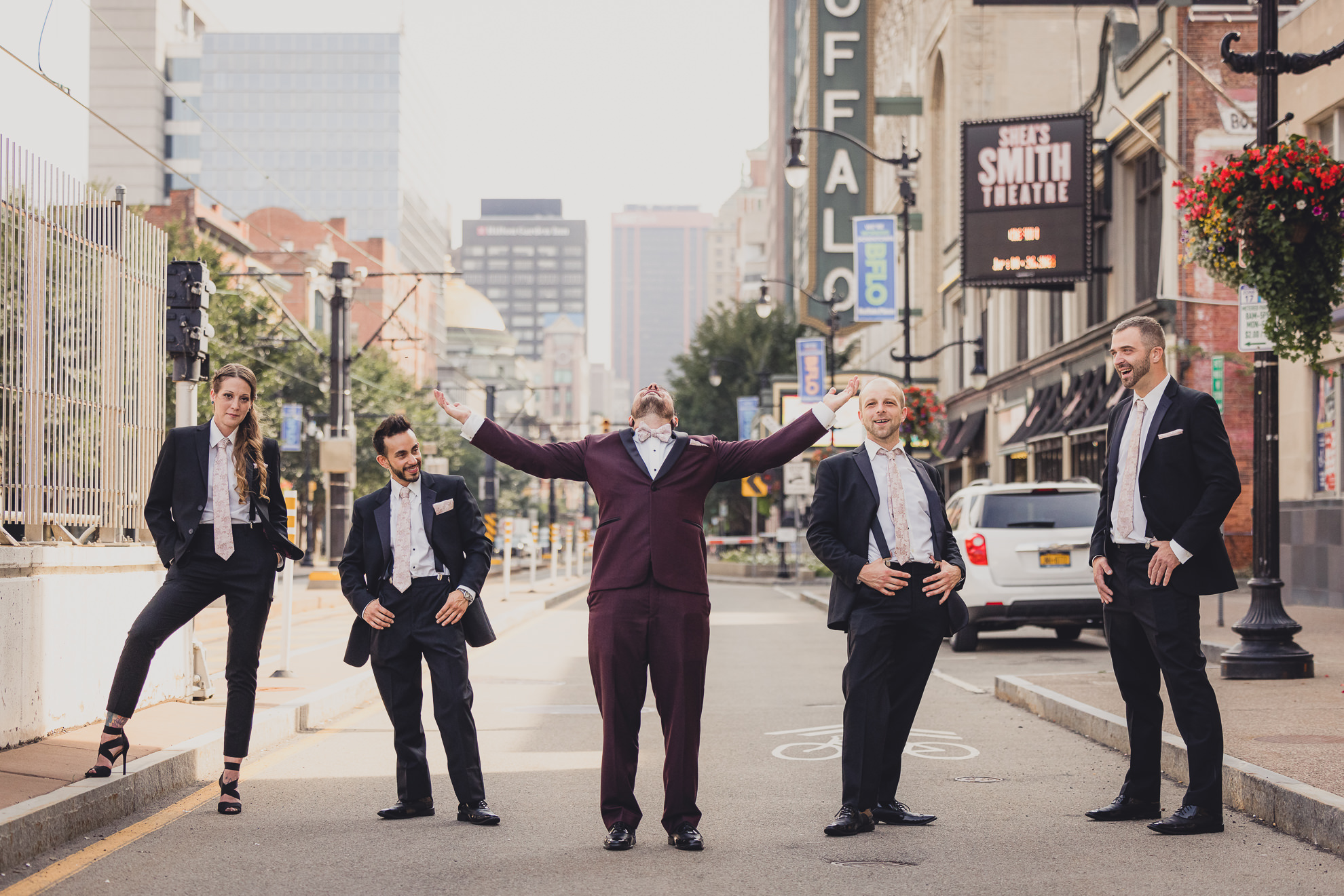 wedding party poses for portraits near Shea's theater in Buffalo, NY