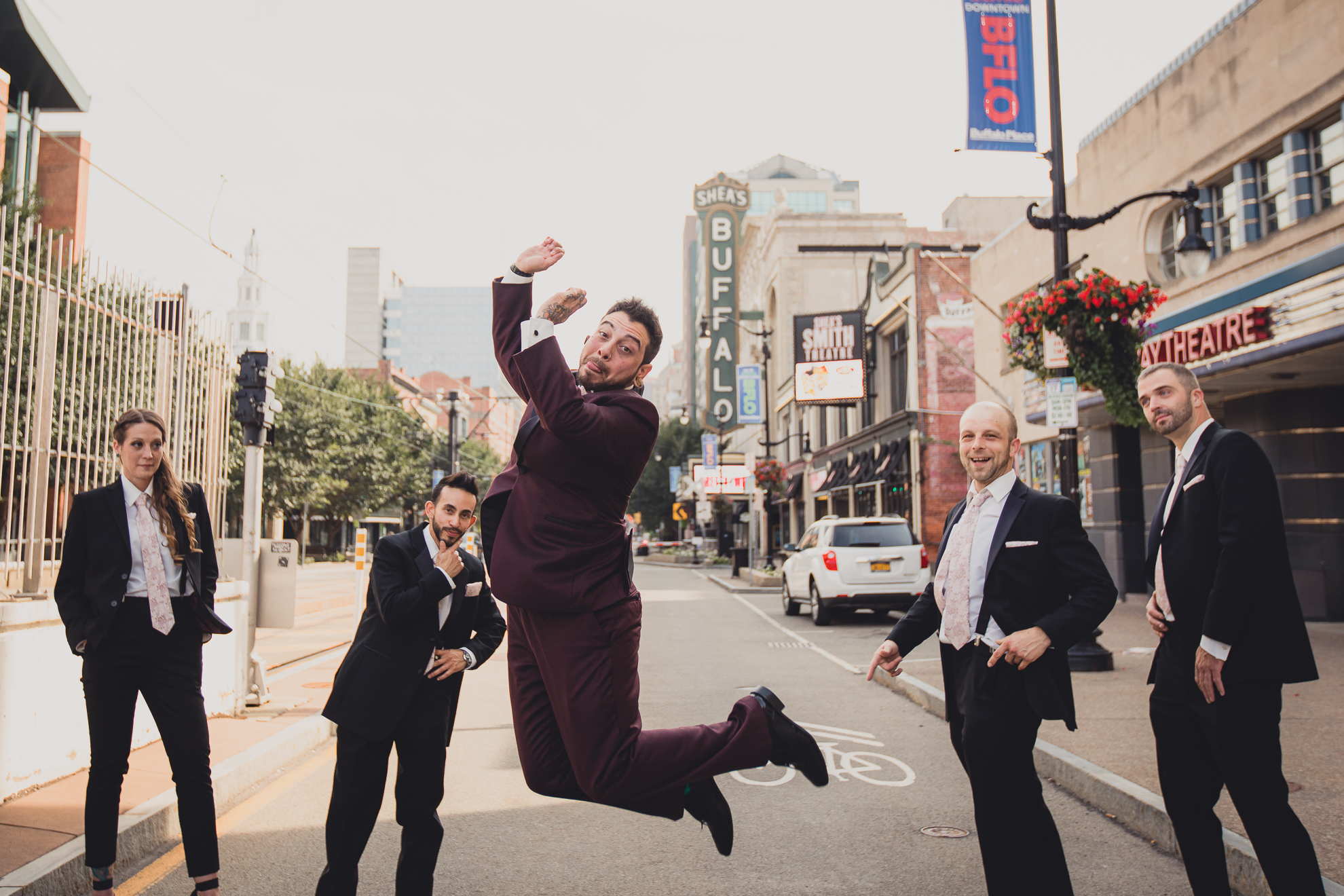wedding party poses for portraits near Shea's theater in Buffalo, NY