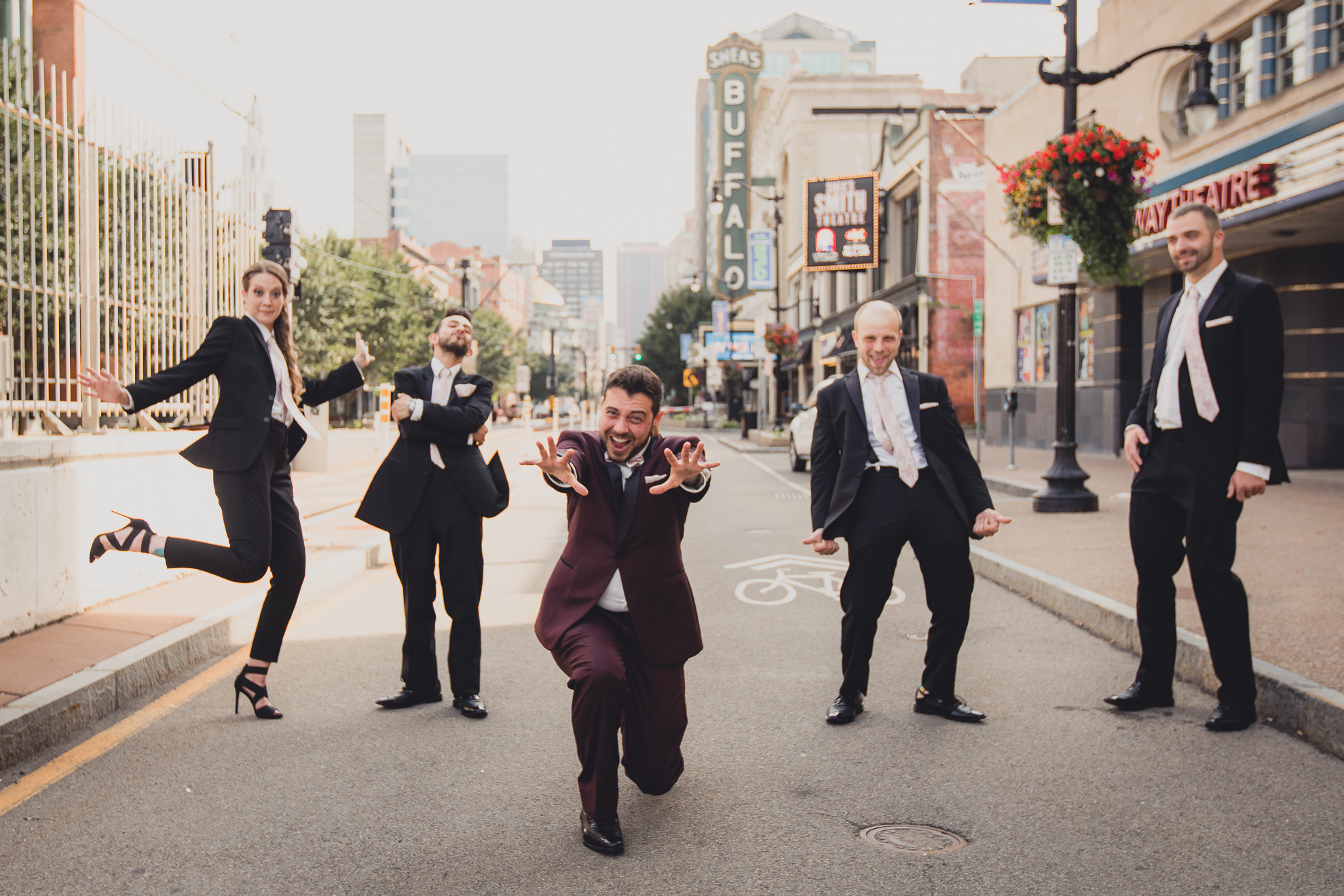 wedding party poses for portraits near Shea's theater in Buffalo, NY