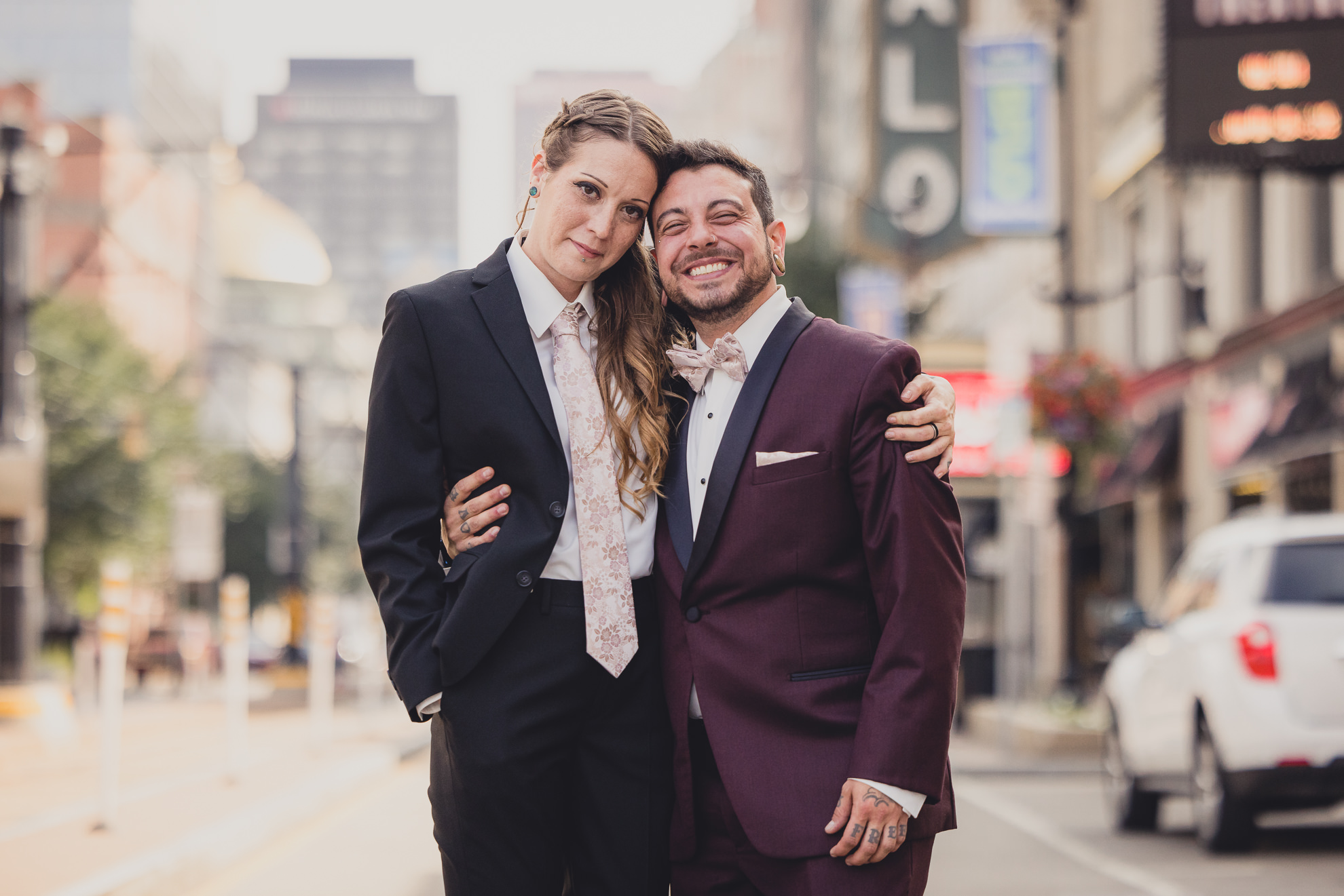 wedding party poses for portraits near Shea's theater in Buffalo, NY
