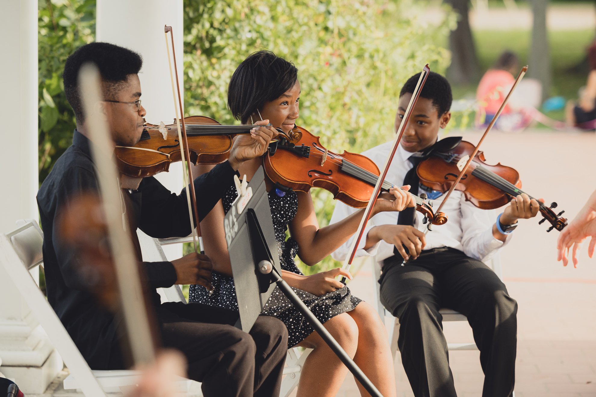 Buffalo String Works students perform during wedding ceremony in rose garden at Marcy Casino in Buffalo, NY