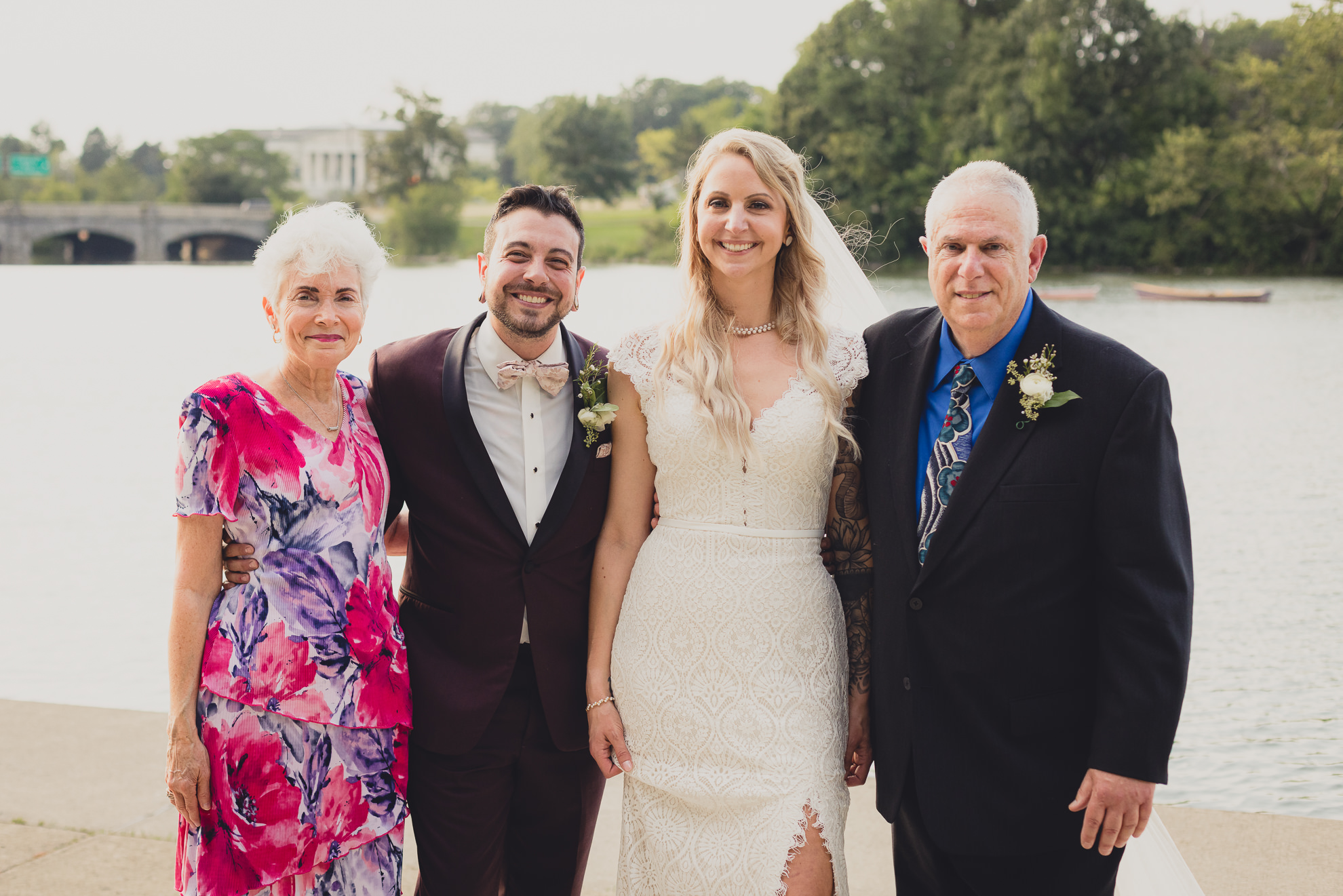 family portrait in front of Hoyt Lake in Delaware Park during wedding at Marcy Casino in Buffalo, NY