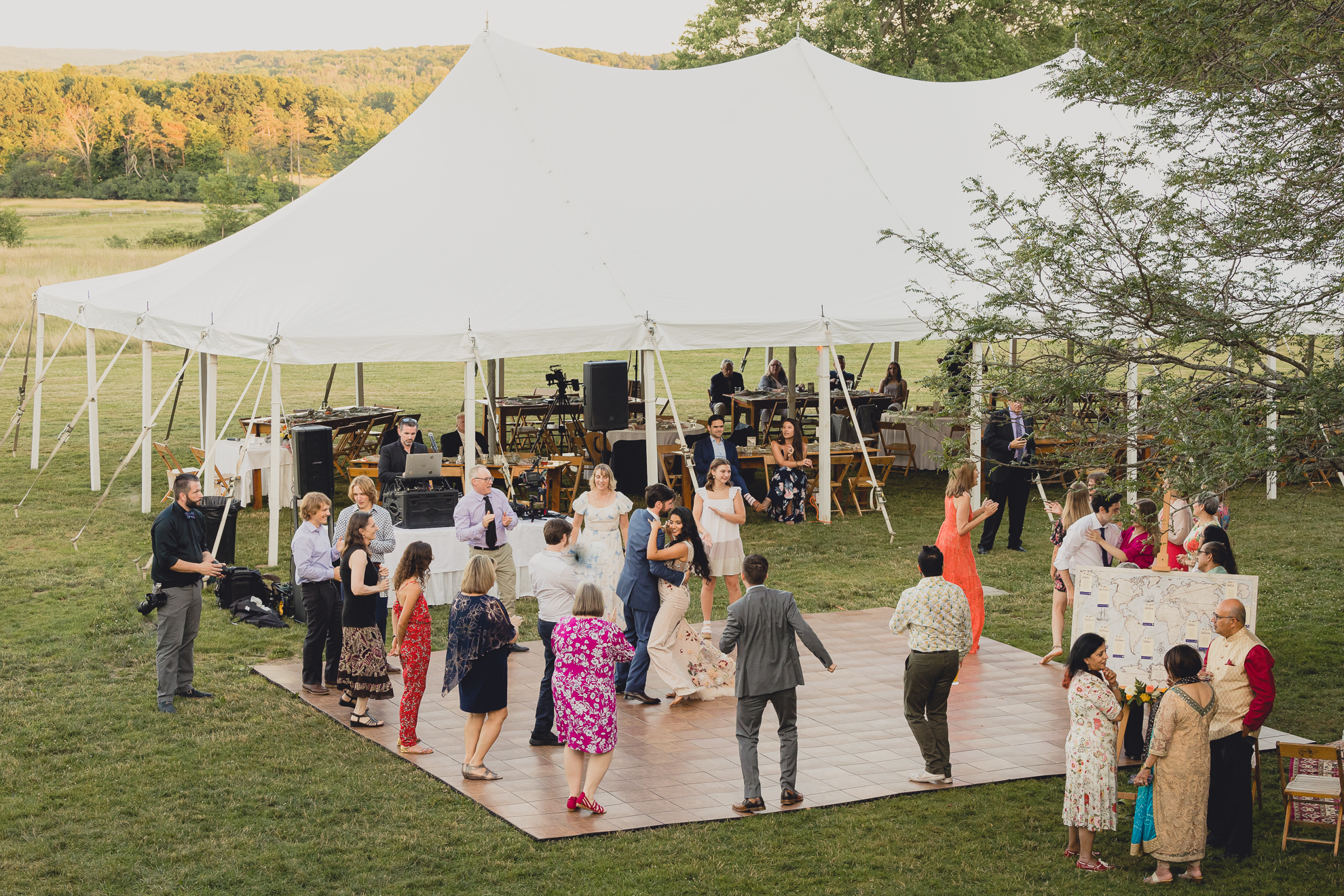 guests dance at outdoor tented wedding reception at Knox Farm in East Aurora, NY