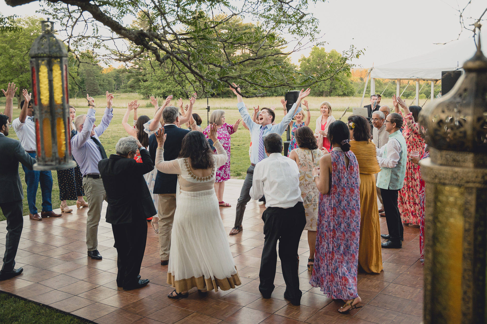 guests dance at outdoor tented wedding reception at Knox Farm in East Aurora, NY
