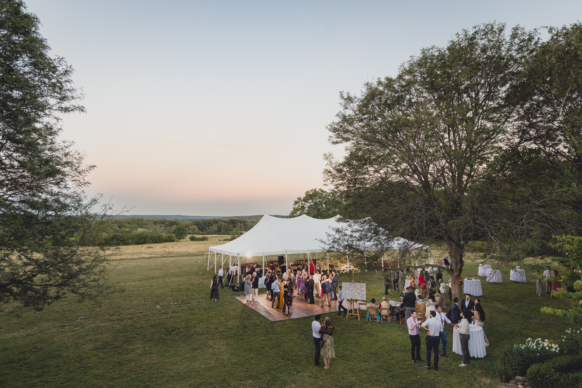 guests dance at outdoor tented wedding reception at Knox Farm in East Aurora, NY