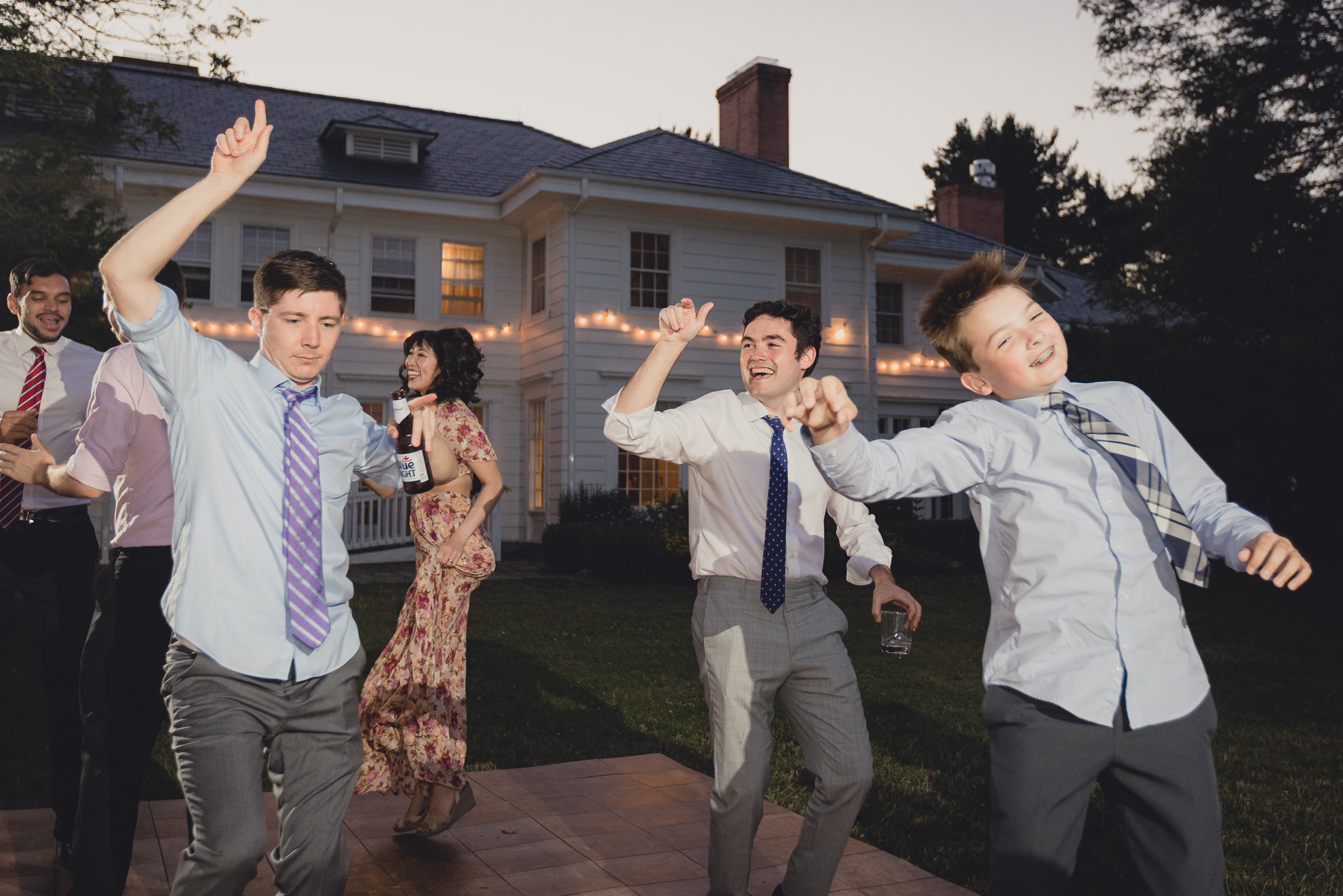 guests dance at outdoor tented wedding reception at Knox Farm in East Aurora, NY
