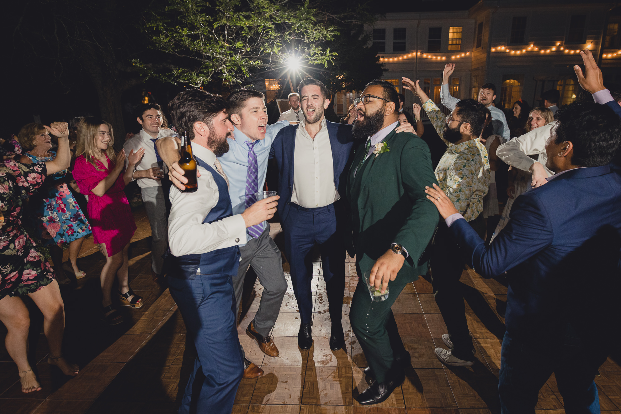 guests dance at outdoor tented wedding reception at Knox Farm in East Aurora, NY