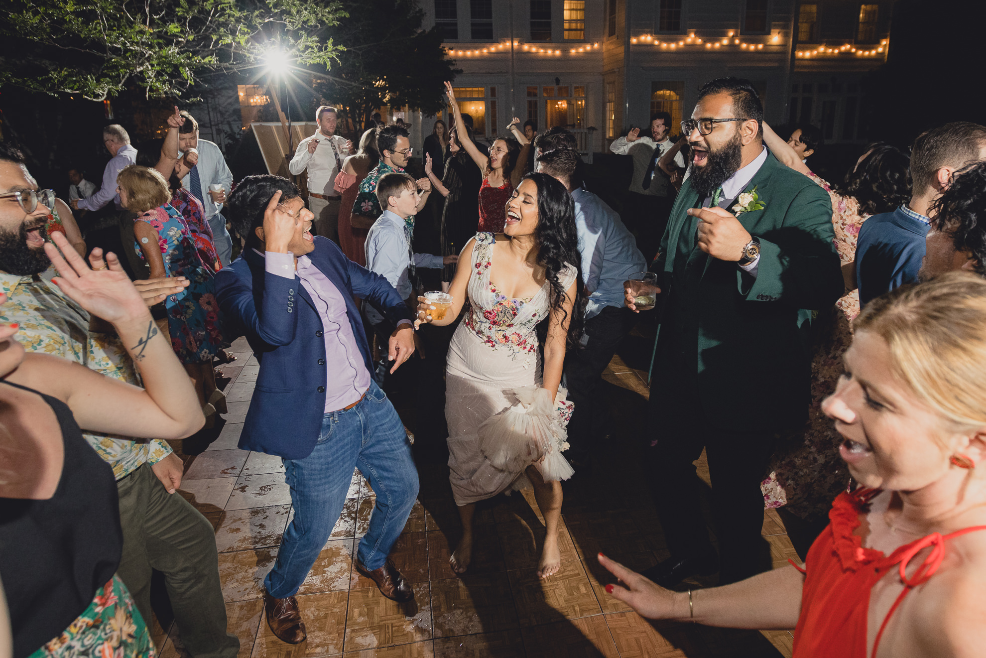 guests dance at outdoor tented wedding reception at Knox Farm in East Aurora, NY