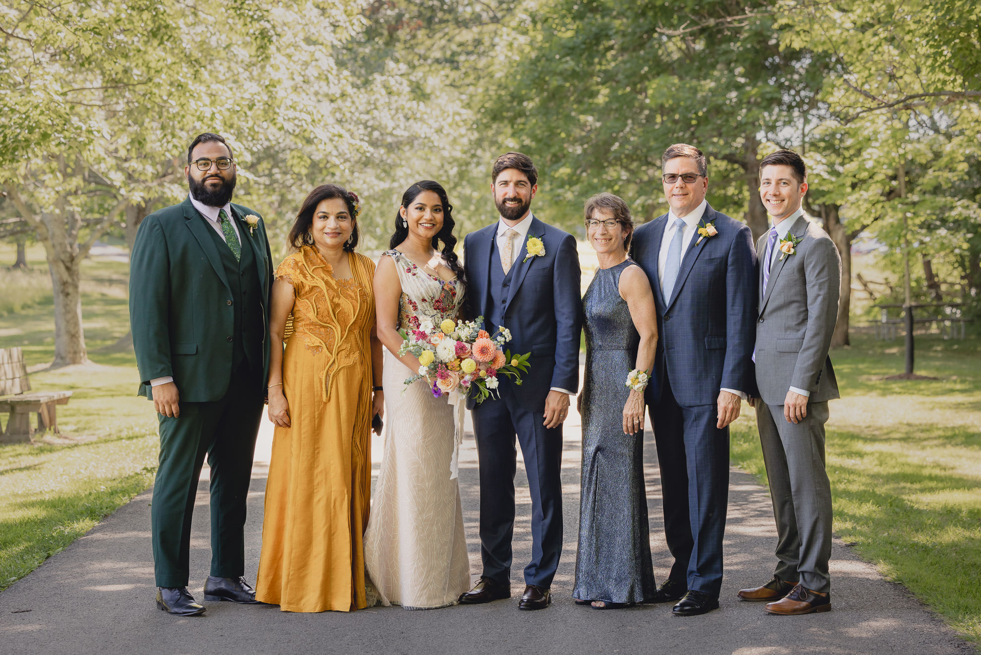 families pose for portrait after wedding ceremony at mansion at Knox Farm in East Aurora, NY