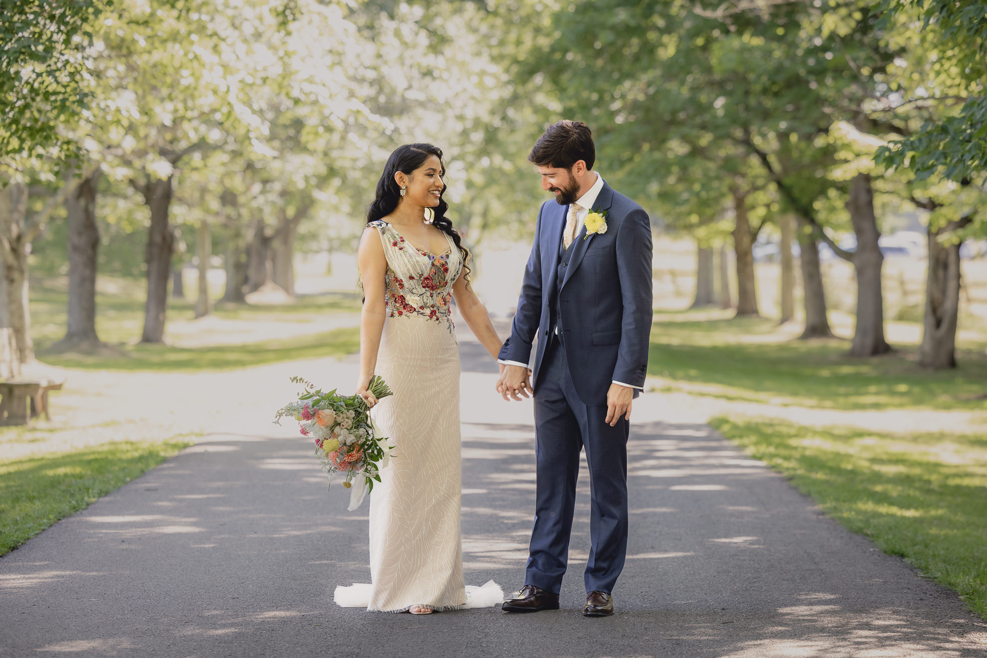 bride and groom pose for portrait after wedding ceremony at mansion at Knox Farm in East Aurora, NY