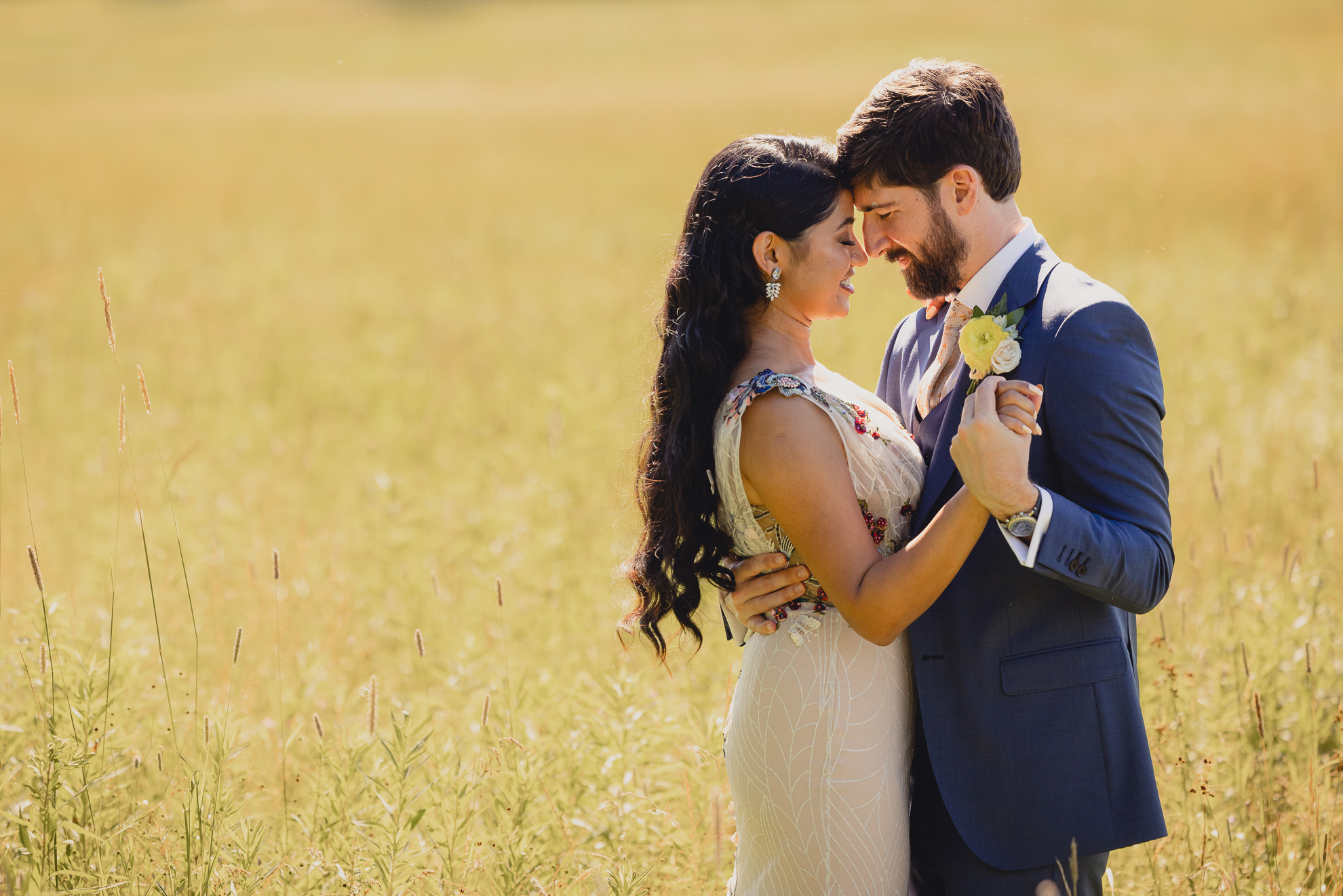 bride and groom pose for portrait after wedding ceremony at mansion at Knox Farm in East Aurora, NY