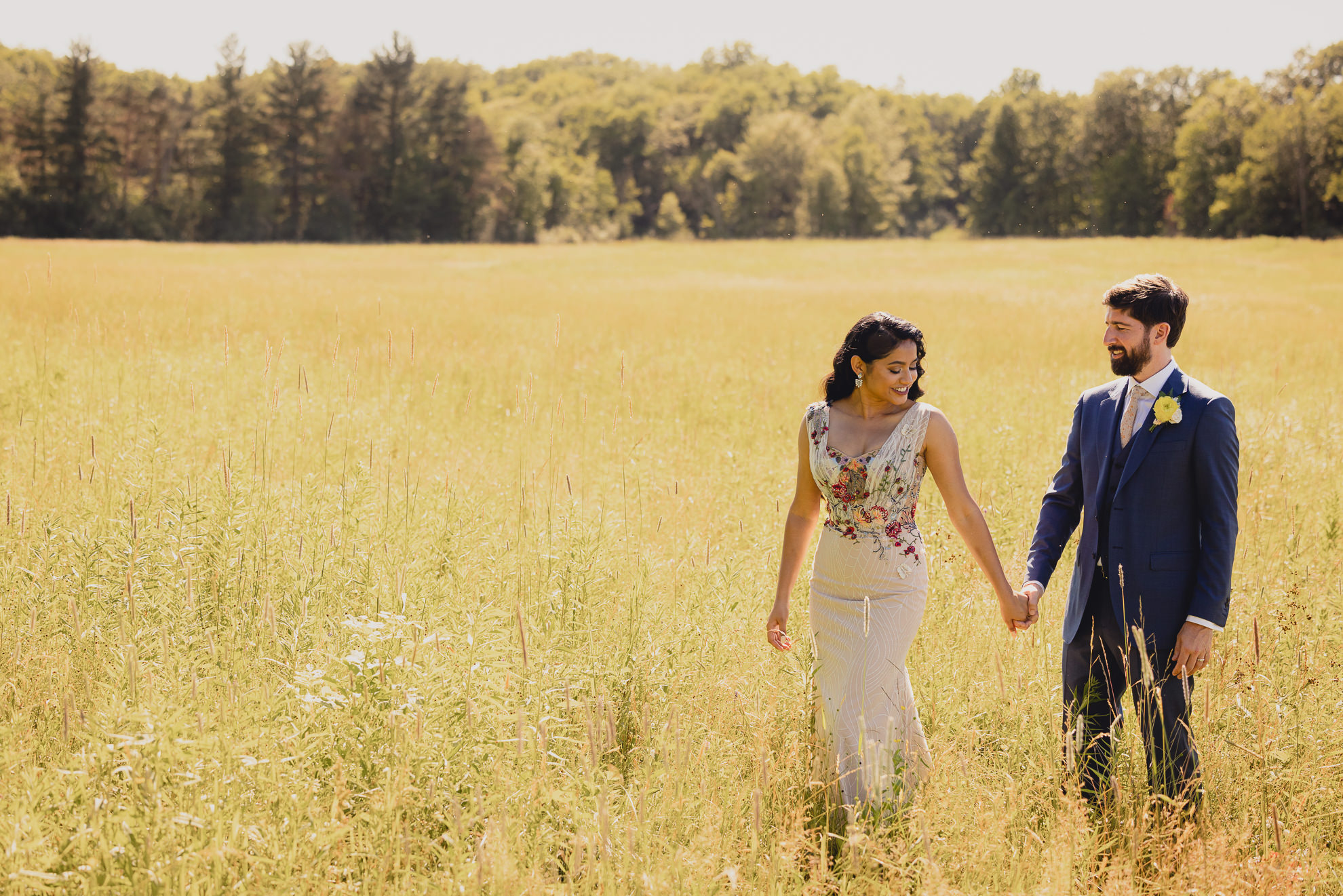 bride and groom pose for portrait after wedding ceremony at mansion at Knox Farm in East Aurora, NY