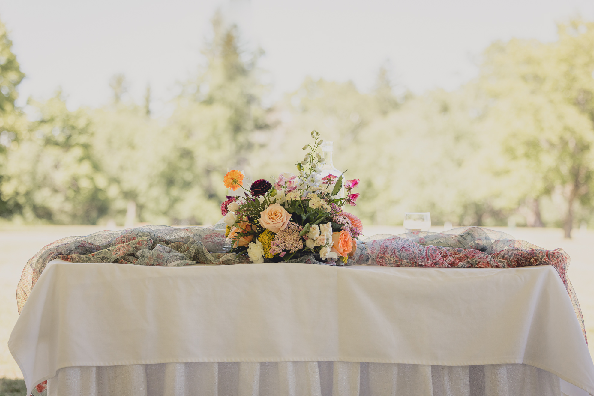 table center piece at outdoor tented wedding reception at Knox Farm in East Aurora, NY
