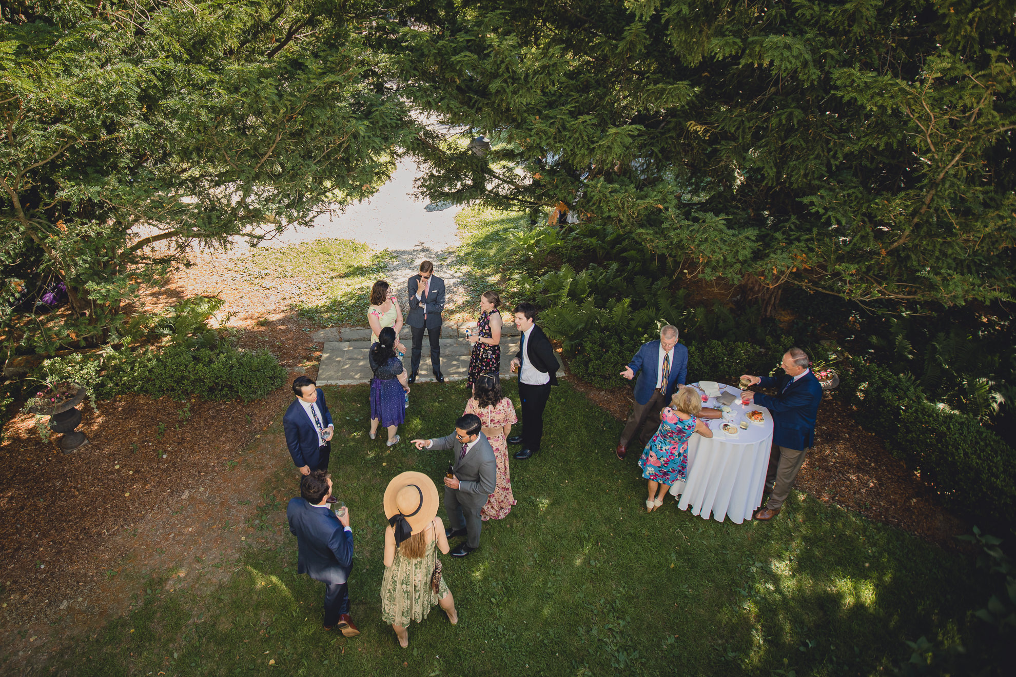 guests gather for cocktail hour at outdoor tented wedding reception at Knox Farm in East Aurora, NY