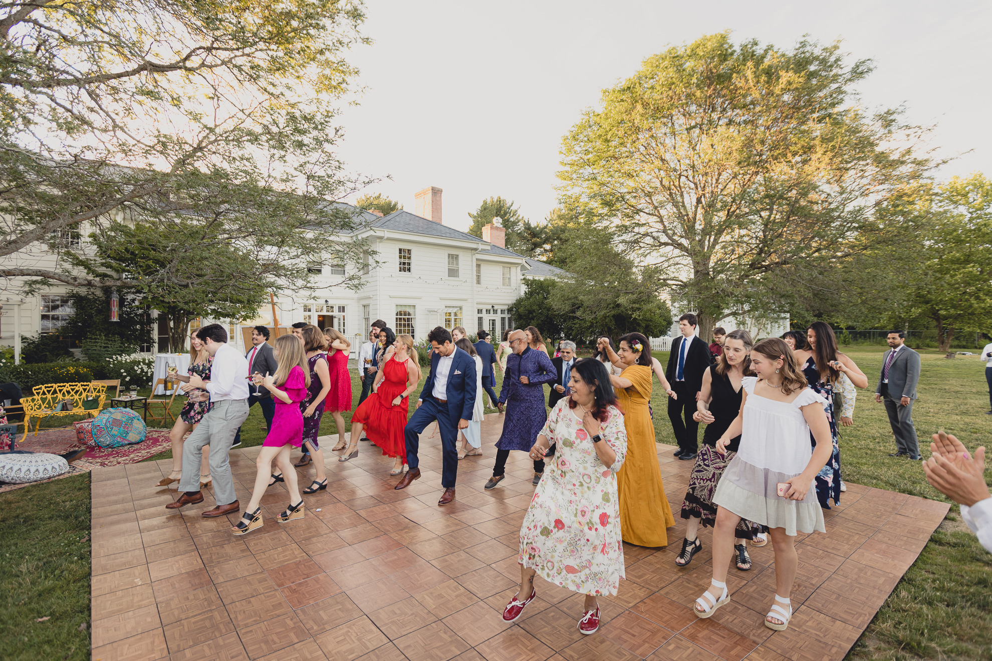 guests dance at outdoor tented wedding reception at Knox Farm in East Aurora, NY