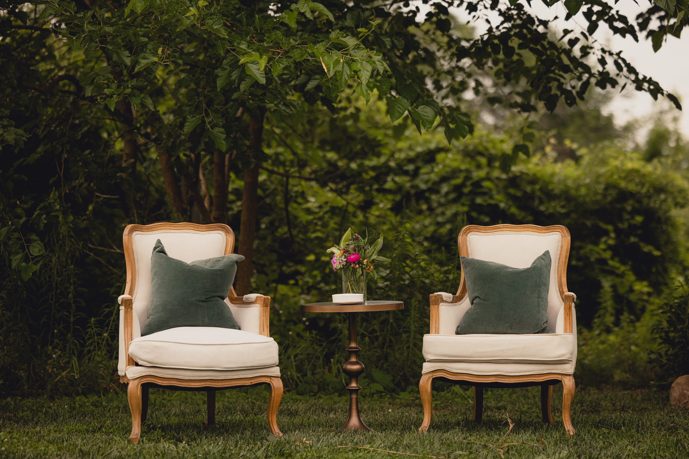 decor styled by Simply Beautiful Events and florals by Pistil and Pollen at wedding reception in barn at The North Farm in Geneva, NY