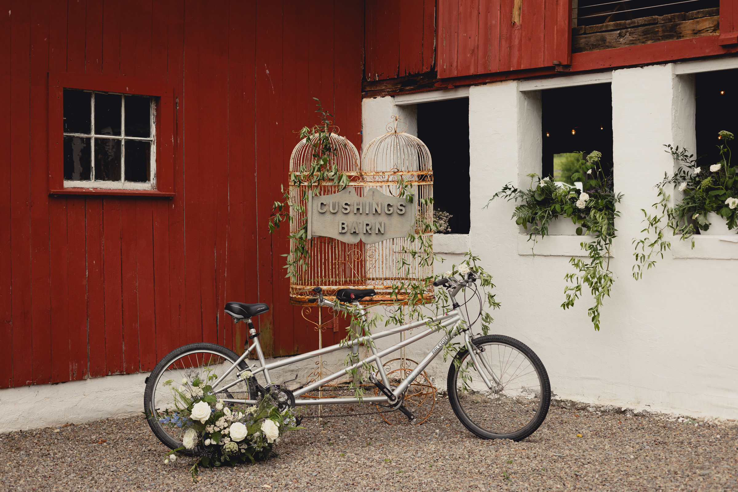decor styled by Simply Beautiful Events and florals by Pistil and Pollen at wedding reception in barn at The North Farm in Geneva, NY