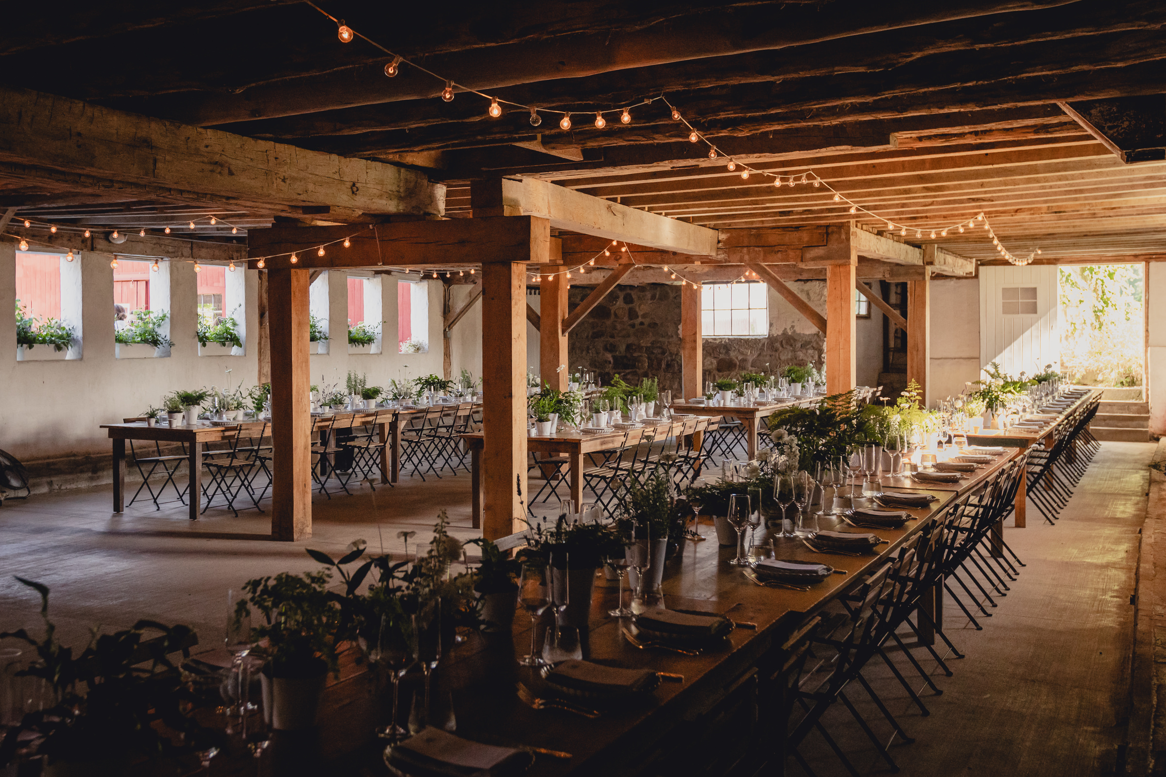 decor styled by Simply Beautiful Events and florals by Pistil and Pollen at wedding reception in barn at The North Farm in Geneva, NY