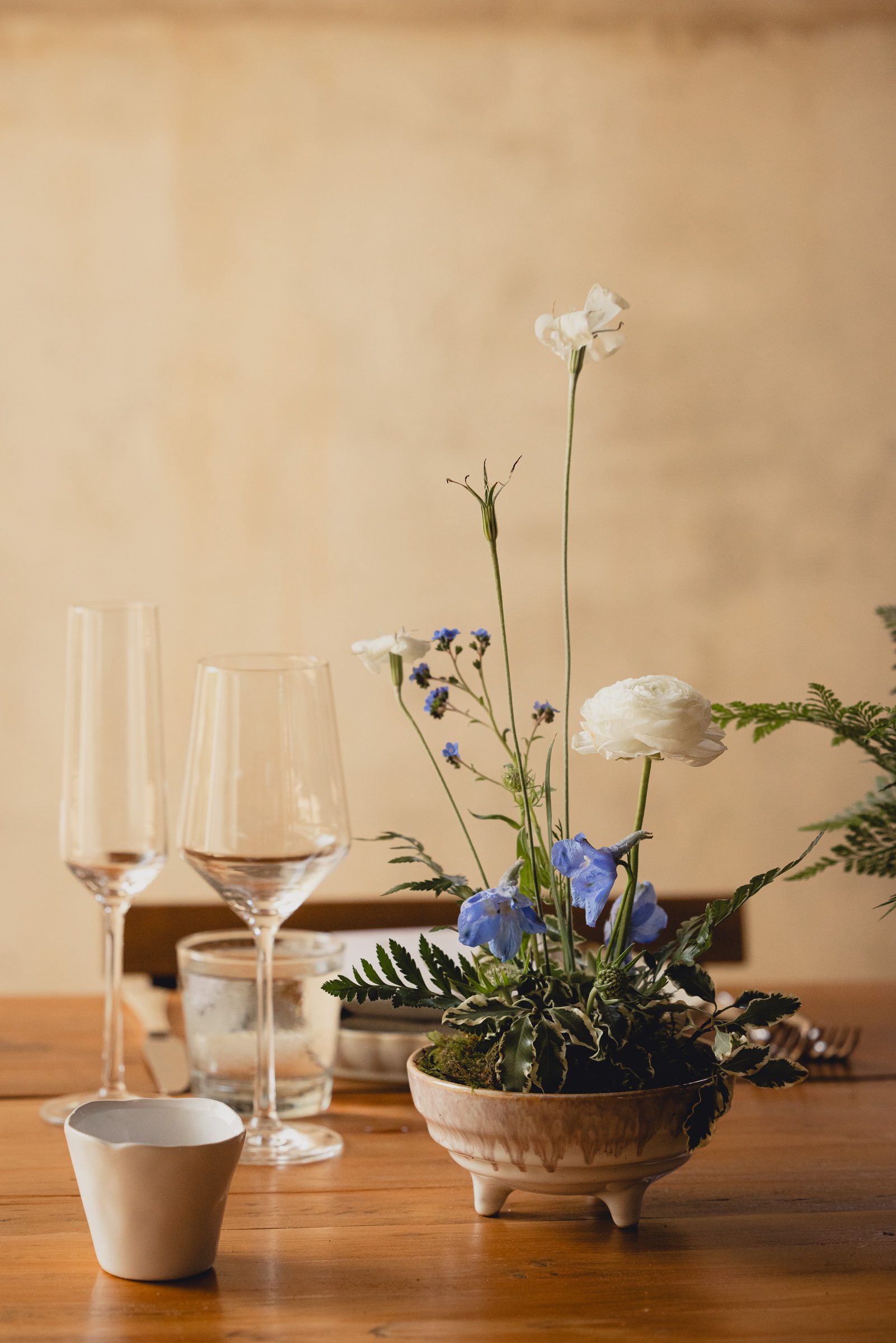 decor styled by Simply Beautiful Events and florals by Pistil and Pollen at wedding reception in barn at The North Farm in Geneva, NY