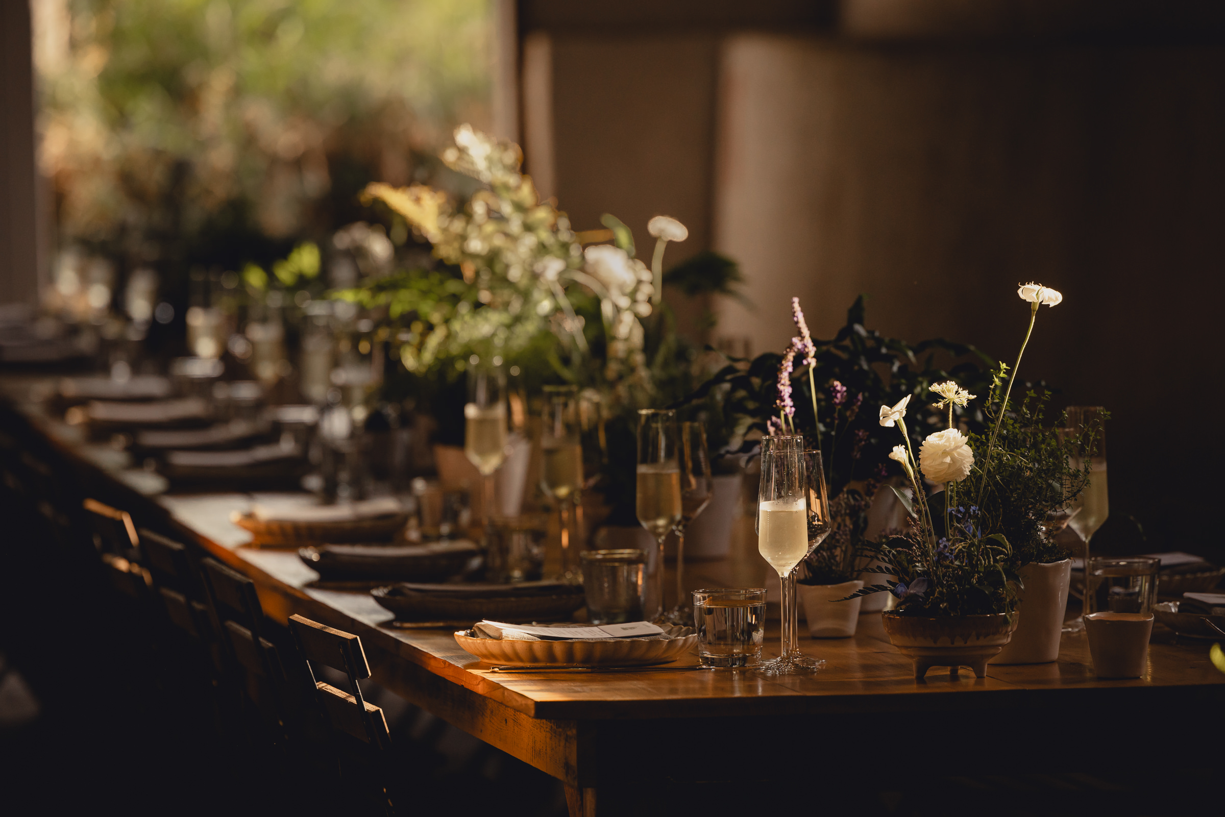 decor styled by Simply Beautiful Events and florals by Pistil and Pollen at wedding reception in barn at The North Farm in Geneva, NY