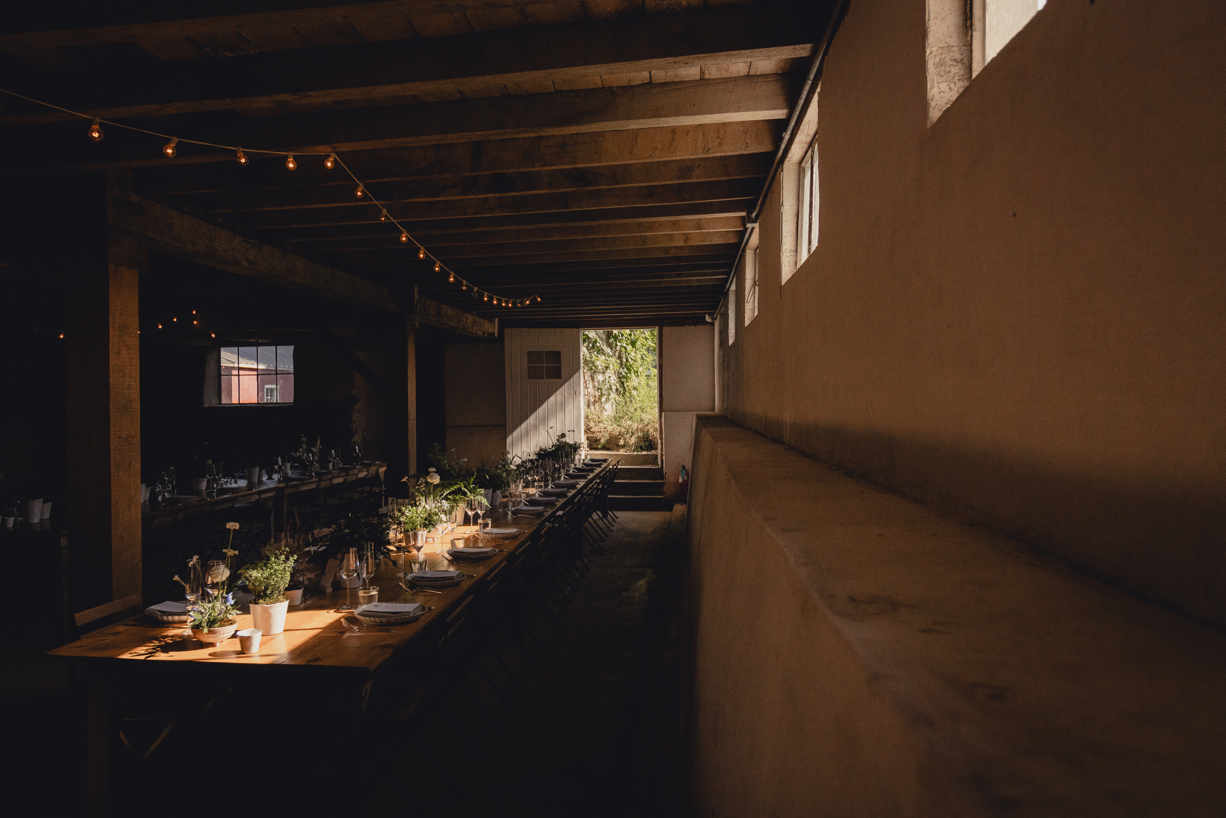 decor styled by Simply Beautiful Events and florals by Pistil and Pollen at wedding reception in barn at The North Farm in Geneva, NY
