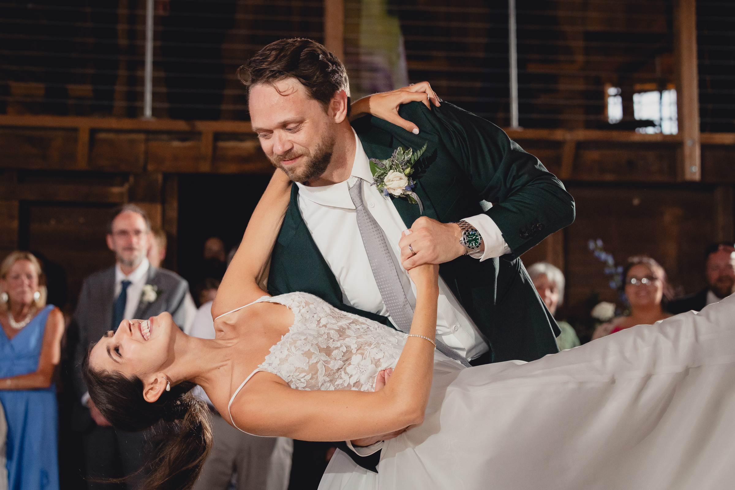 bride and groom dance at wedding reception in barn at The North Farm in Geneva, NY