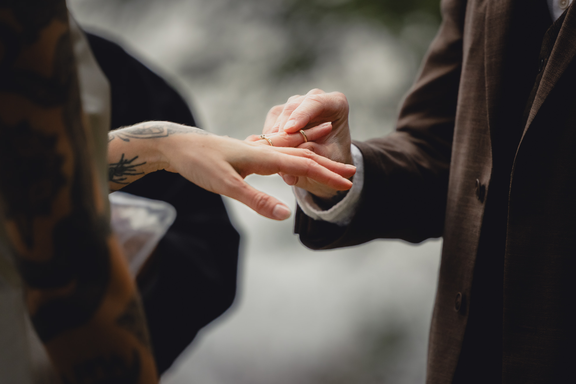 groom places ring on brides finger during micro wedding elopement ceremony at Vanderkamp NY in the Adirondack Mountains