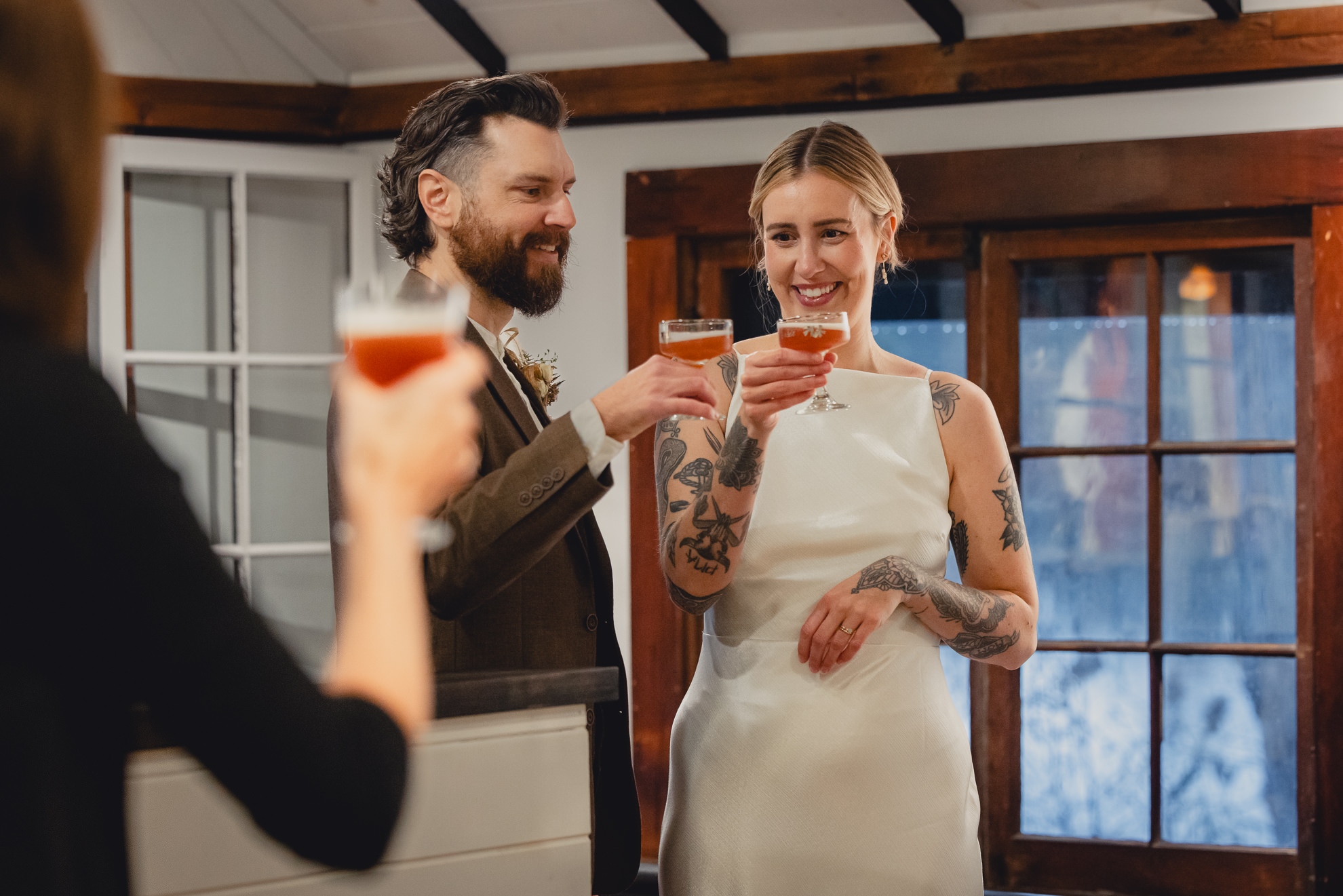 bride and groom toast after micro wedding elopement at Vanderkamp NY in the Adirondacks